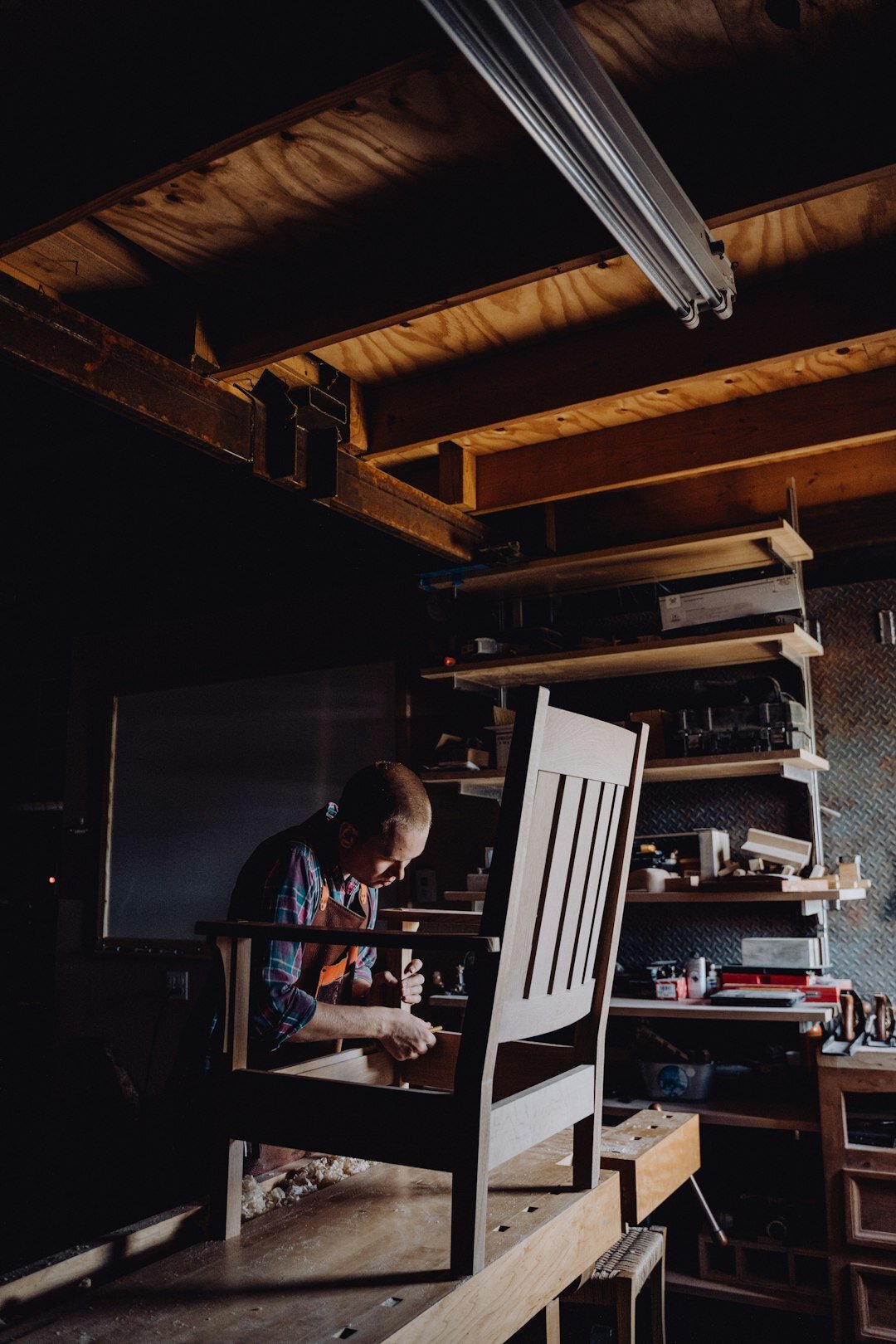 Danish craftsman working with wood in his workshop