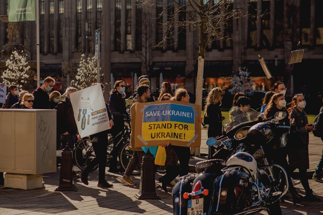 protesters holding signs in street