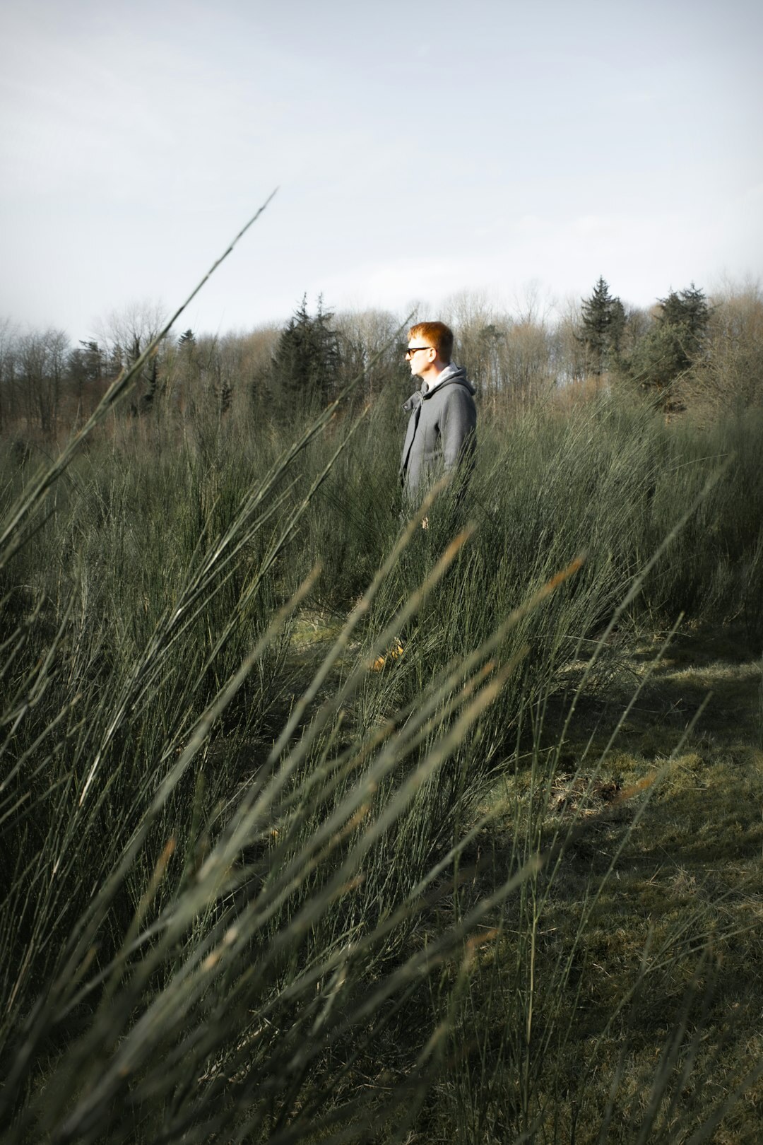 Danish female documentary photographer holding a camera outdoors