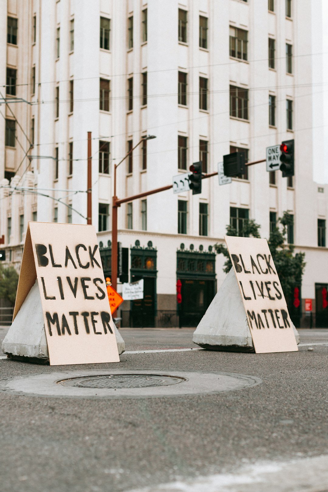 protesters holding signs in street