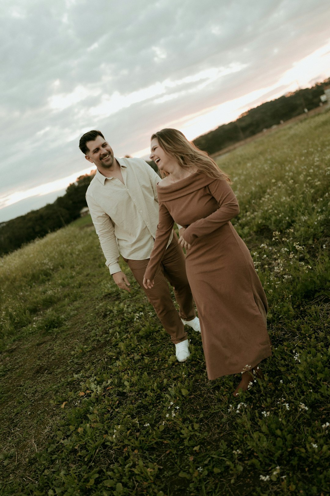 Young Danish couple laughing together in the countryside